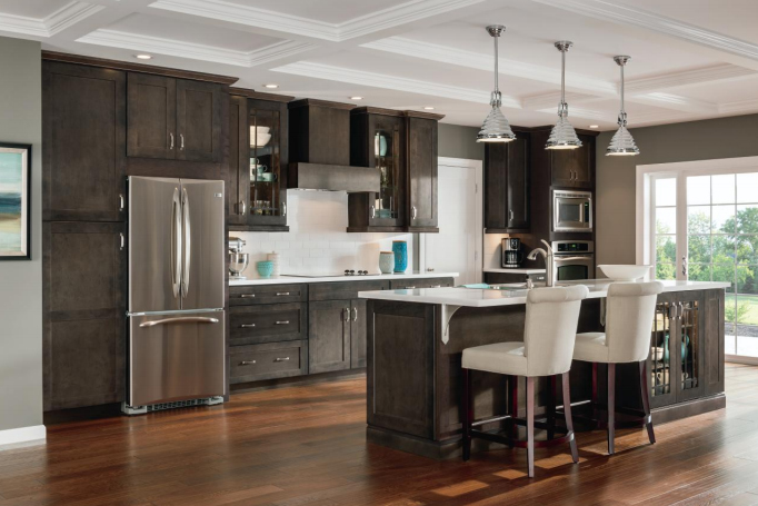 Dark wood cabinets and dark flooring in kitchen