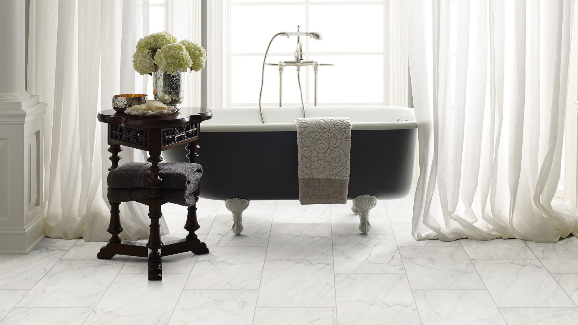 white marble look ceramic tile flooring in an elegant bright bathroom
